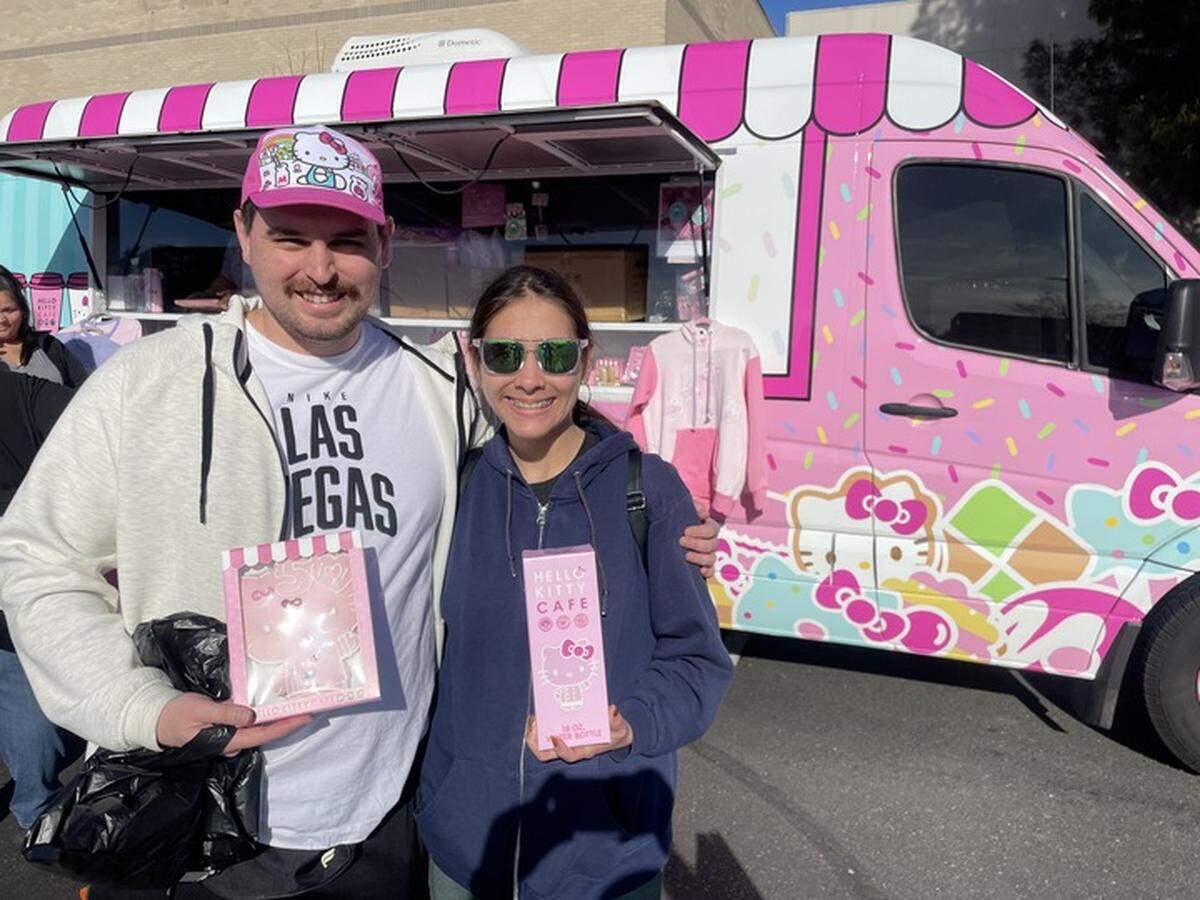 Matthew Tibbitts and Taylor Moss purchased a giant Hello Kitty cookie and a thermal bottle from the Hello Kitty Cafe pop-up truck in Sacramento on Saturday.