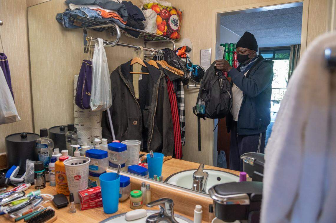 Rogers holds a small backpack, the only thing he was allowed to bring with him when he moved to the Vagabond Inn, where he found temporary housing through Project Roomkey. Now he has found permanent housing and will have a place to move all his things since entering the program last June.