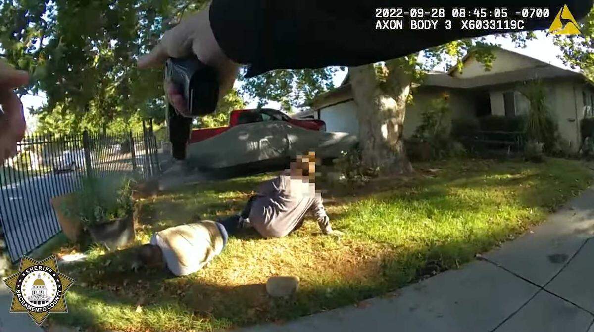 In an image taken from a body-worn camera, a Sacramento sheriff’s deputy is seen shooting a subject who charged at him with a machete at a home Sept. 28, 2022, in south Sacramento. The Sheriff’s Office released the video as part of its protocol for shootings involving deputies.