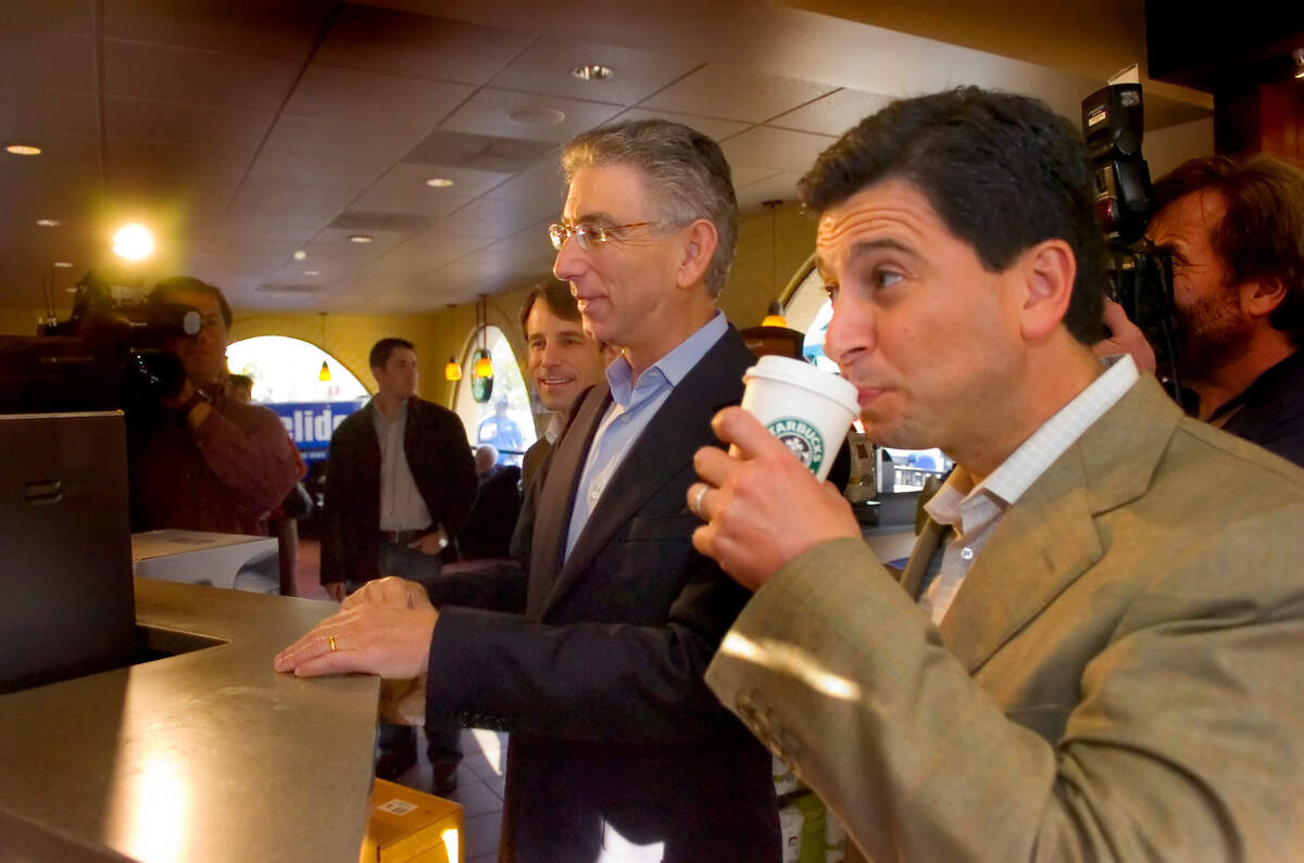 Speaker of the Assembly Fabian Nunez drinks coffee bought for him by state Treasurer Phil Angelides, who was campaigning for governor, at Starbucks on Alhambra Boulevard in Sacramento on Oct. 24, 2006.