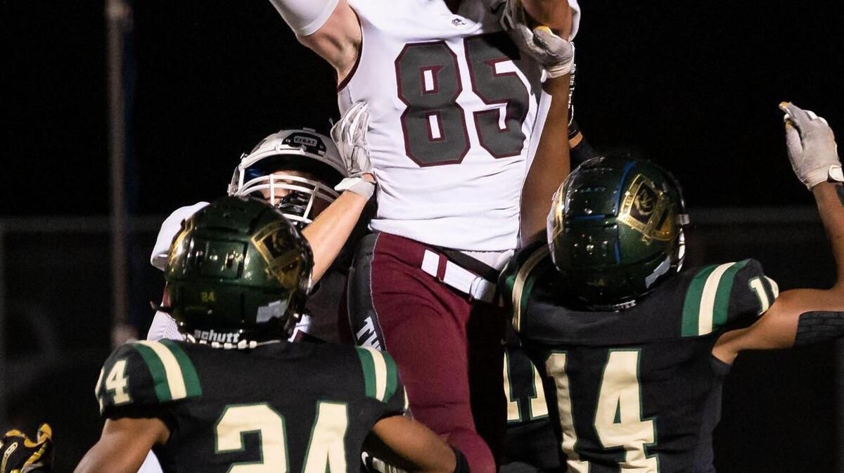 Woodcreek High School wide receiver Nicolai Nielsen (85) makes a leaping touchdown reception in the back of the end zone over the Monterey Trail secondary during the fourth quarter of the high school football playoff game Friday, Nov. 5, 2021, at Monterey Trail High School in Elk Grove.