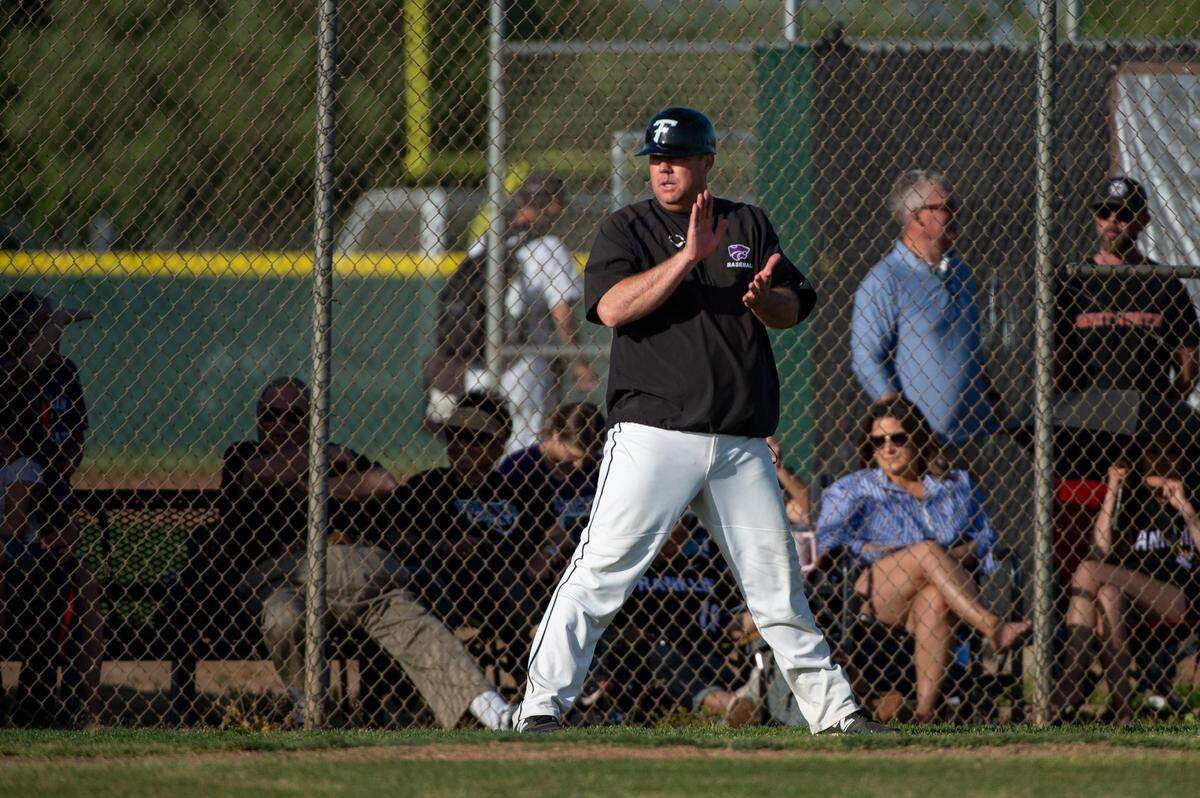 Franklin Wildcats coach Bryan Kilby claps for his team after outfielder Jordan Lopez hits an RBI double in the fifth inning during a game against Pleasant Grove Eagles on Monday, April 24, 2023, at Franklin High School in Elk Grove. The Wildcats defeated the Eagles 7-3.