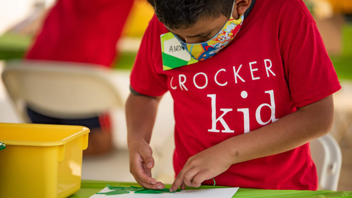 Alex Moctezuma works works on a project at a weeklong art camp at the Crocker Art Museum.