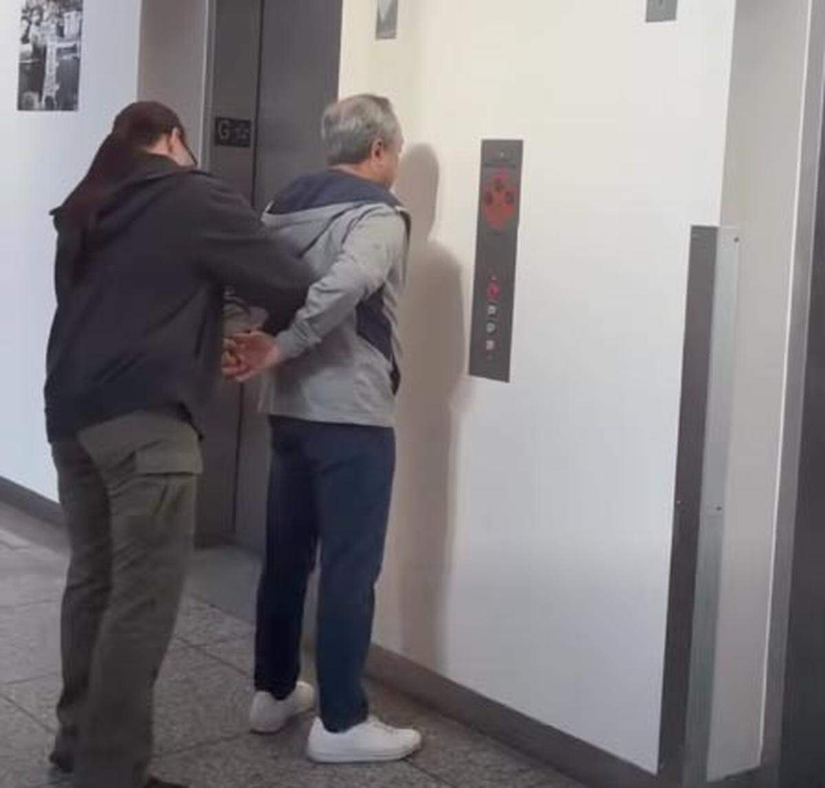 Former Capital Public Radio general manager Jun Reina is taken into custody in an image from video released by the Sacramento County Sheriff’s Office on Thursday.