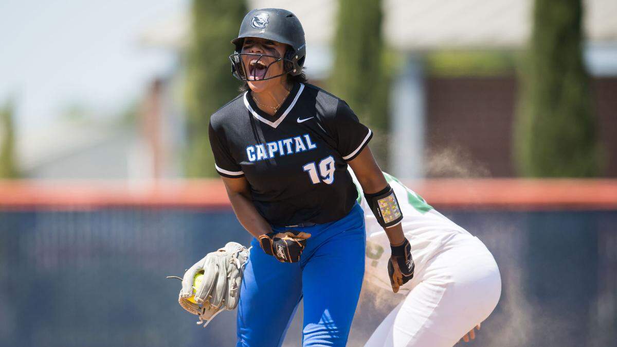 Capital Christian Cougars batter Ayla Tuua (19) celebrates hitting a double against the Dixon Rams during the fifth inning at the CIF Sac-Joaquin Section Division IV high school softball championship game Saturday, May 27, 2023, at Cosumnes River College.