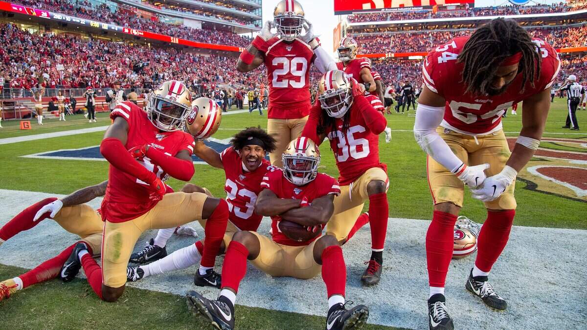 San Francisco 49ers’ D.J. Reed Jr. (32) ,San Francisco 49ers’ Emmanuel Moseley (41), and San Francisco 49ers’ Jeff Wilson Jr. (30) celebrate the final touchdown in the fourth quarter against the Arizona Cardinals during a game at Levi’s Stadium on Sunday, November 17, 2019 in Santa Clara.