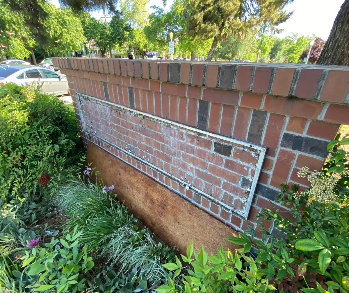A Brick wall is missing a sign. On April 14, 2024, East Sacramento’s welcome sign was stolen from McKinley Park.