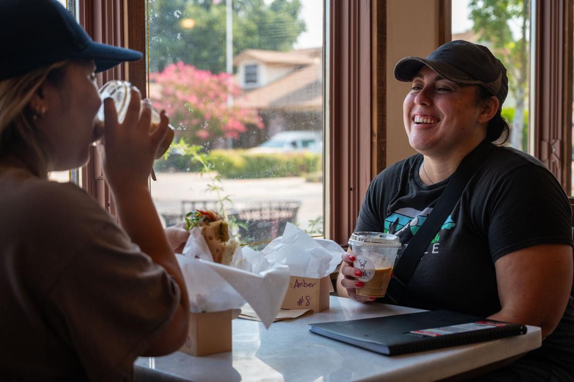 South sacramento resident Mai Thao and Galt resident Amber Garcia eat at Tule Coffeehouse in Elk Grove on Saturday, July 20, 2024. “It was the perfect little spot to get some work done,” Garcia said after the two played a game of pickleball nearby.