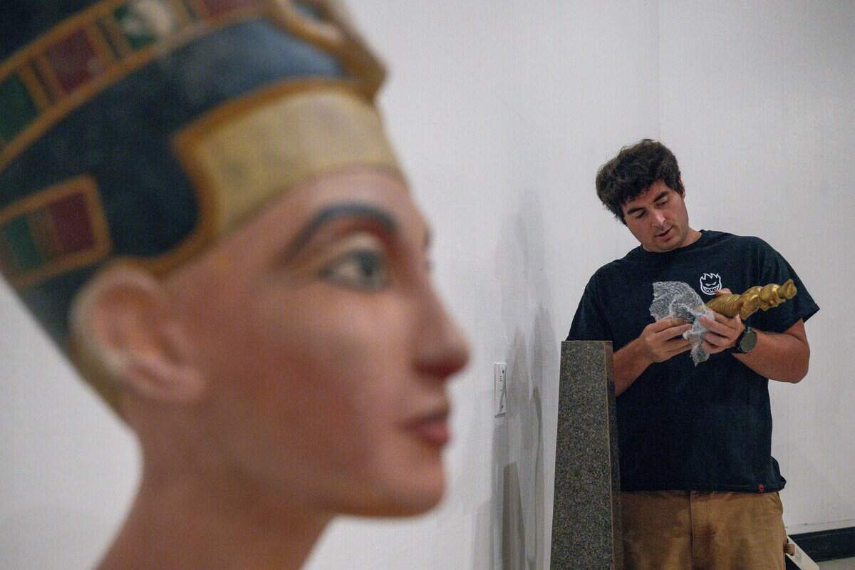 Exhibit Technician Austin Clarks inspects the King Tut replica during the California State Fair media day at Cal Expo in Sacramento on Wednesday, July 15, 2026.
