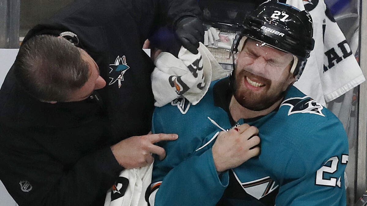 San Jose’s Joonas Donskoi gets medical attention on the bench in the third period in Game 5 of the NHL hockey Stanley Cup Western Conference finals against the St. Louis Blues on Sunday.