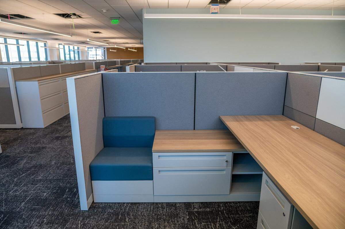 A seat is built into this cubicle’s file cabinets on the third floor of the building.
