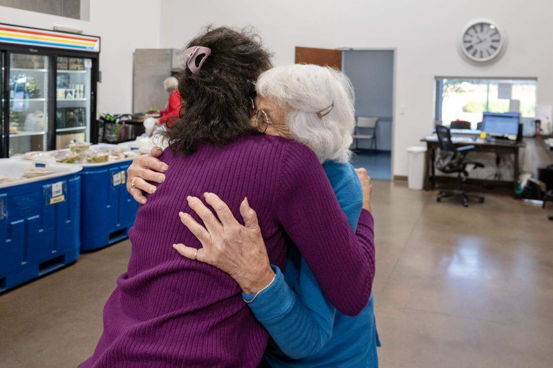 Elk Grove Food Bank executive director Marie Jachino embraces a thankful client receiving assistance on Saturday, Nov. 1, 2025, in Elk Grove. The food bank has seen a significant increase in clients seeking help.