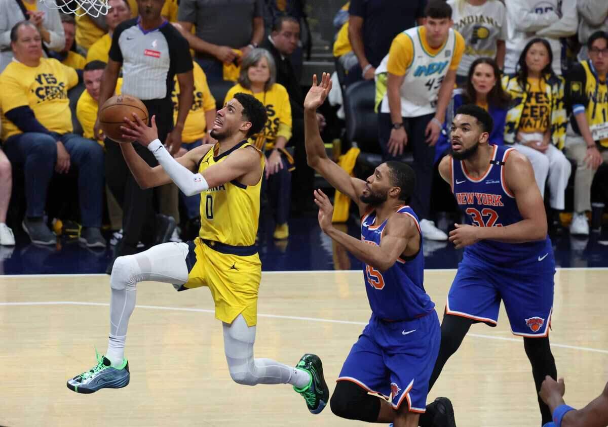 Pacers guard Tyrese Haliburton (0) drives to the hoop past the New York Knicks during Tuesday’s Eastern Conference Finals game in Indianapolis. The former King and his new team are a win away from the NBA Finals.