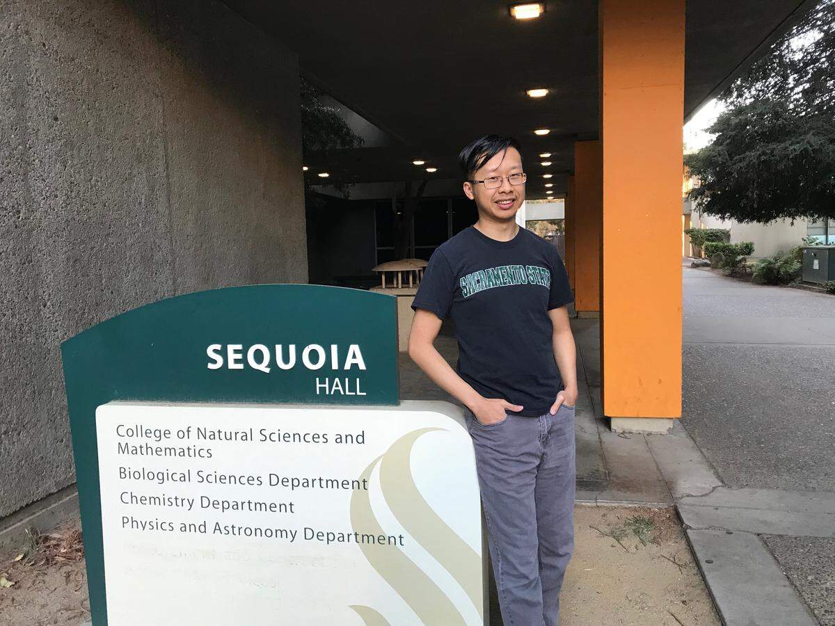 Young Xiong, Sacramento State alumni and biochemistry major, stands at the University building where the chemistry department is at.