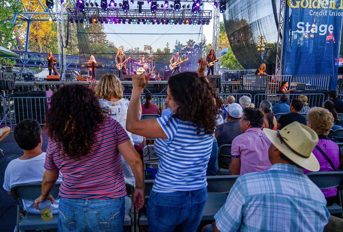 Audience members dance to Petty & the Heartshakers, a Tom Petty tribute band, as they perform at the State Fair on in 2019 at Cal Expo.