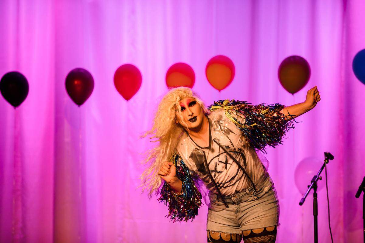 Drag queen Iris Omega performs in Loomis’ McLaughlin Theatre.