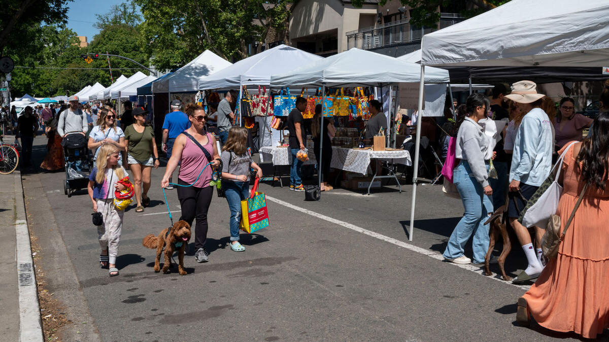 People shop at the Midtown Farmer’s Market on Saturday, April 30, 2022. It’s ​is a free and ​family-friendly year-round market that offers locally-grown fresh produce, prepared foods, artisian crafters and more. It’s open 8 a.m. to 1 p.m. on Saturdays on 20th Street between J and L streets and K Street between 19th and 21st streets.