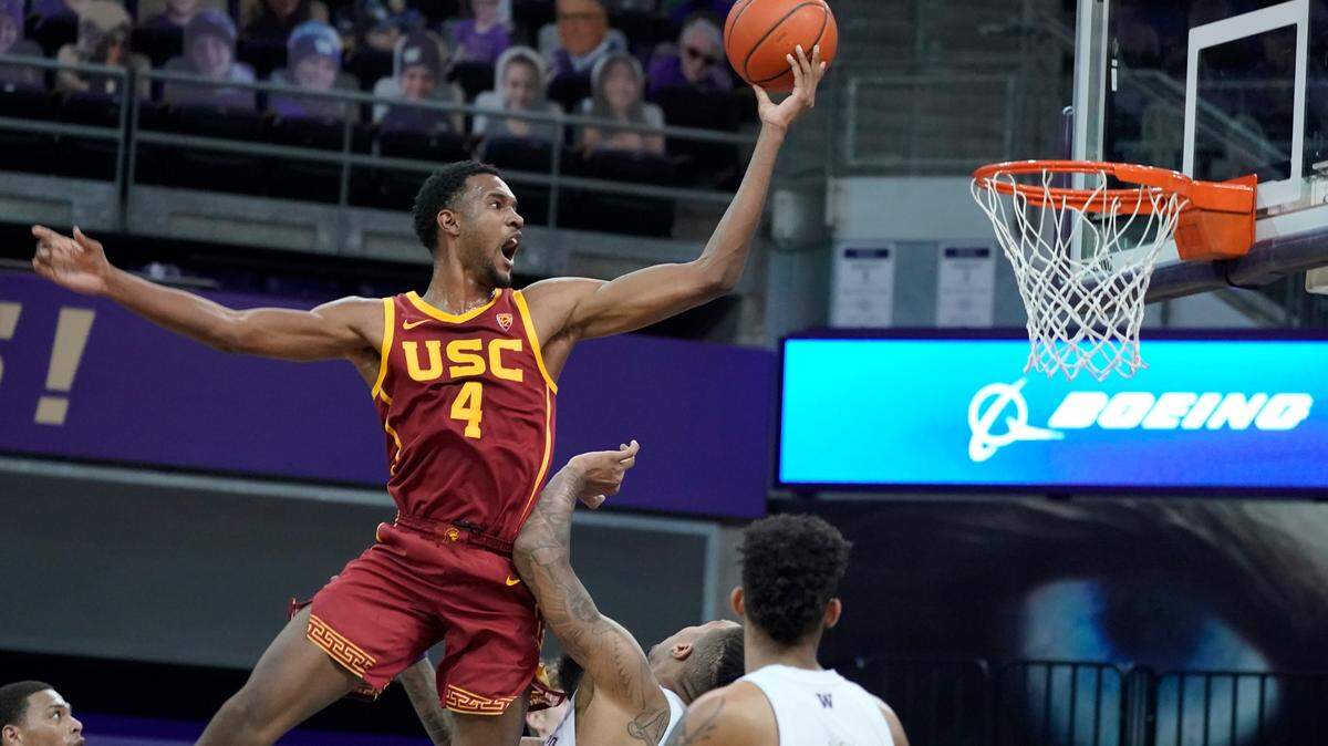 Southern California forward Evan Mobley (4) shoots against Washington during the second half of an NCAA college basketball game, Thursday, Feb. 11, 2021, in Seattle. (AP Photo/Ted S. Warren)