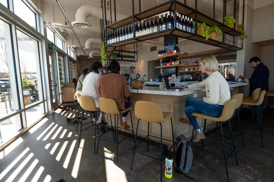Patrons sit Wednesday at Franquette, a “sister” restaurant to East Sacramento’s celebrated Canon restaurant, that opened Feb. 16.
