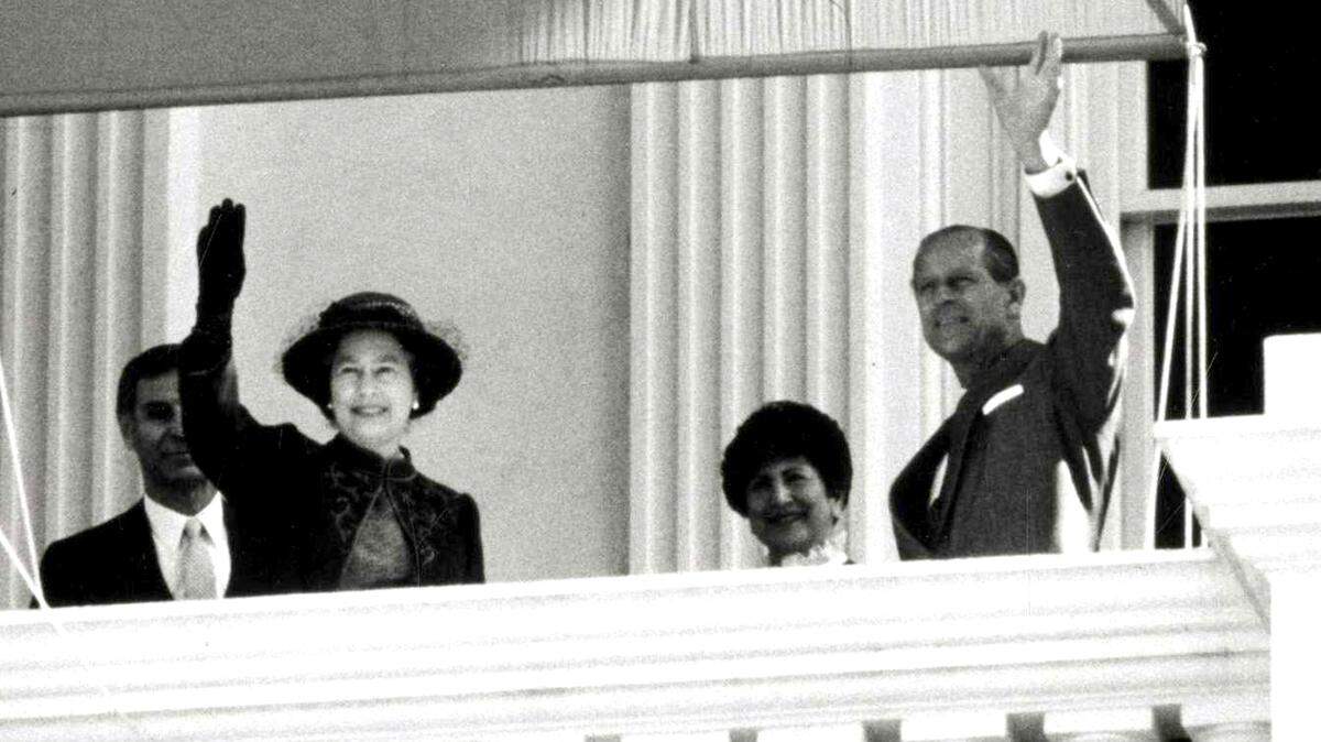 Queen Elizabeth II and Prince Phillip wave to the crowd from the state Capitol in Sacramento during their visit in March 1983.