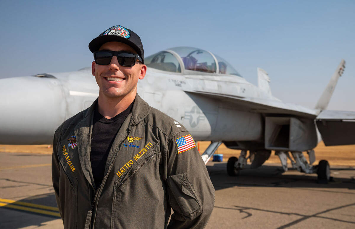 U.S. Navy pilot Lt. Matteo “Hog Sweat” Mezzetti, a Sacramento native, stands with his F/A-18F Super Hornet, also known as the “Rhino,” before the California Capital Airshow on Friday, Sept. 24, 2021, at Mather Airport in Sacramento.