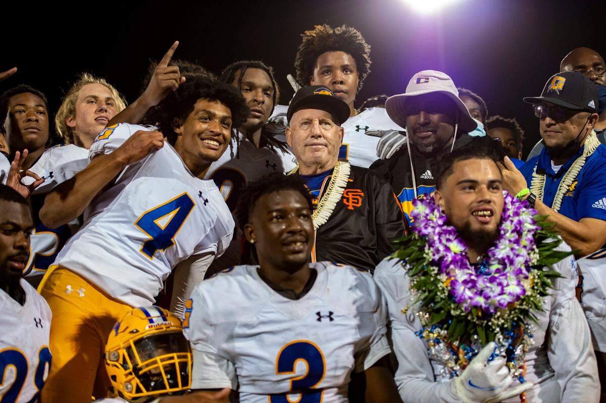 Grant High School head coach Mike Alberghini poses for photos with his team after winning the final game of the season – and his career at Grant – on Friday, April 16, 2021, against Capital Christian in Rancho Cordova. It was Alberghini’s 282nd win, setting a section record.
