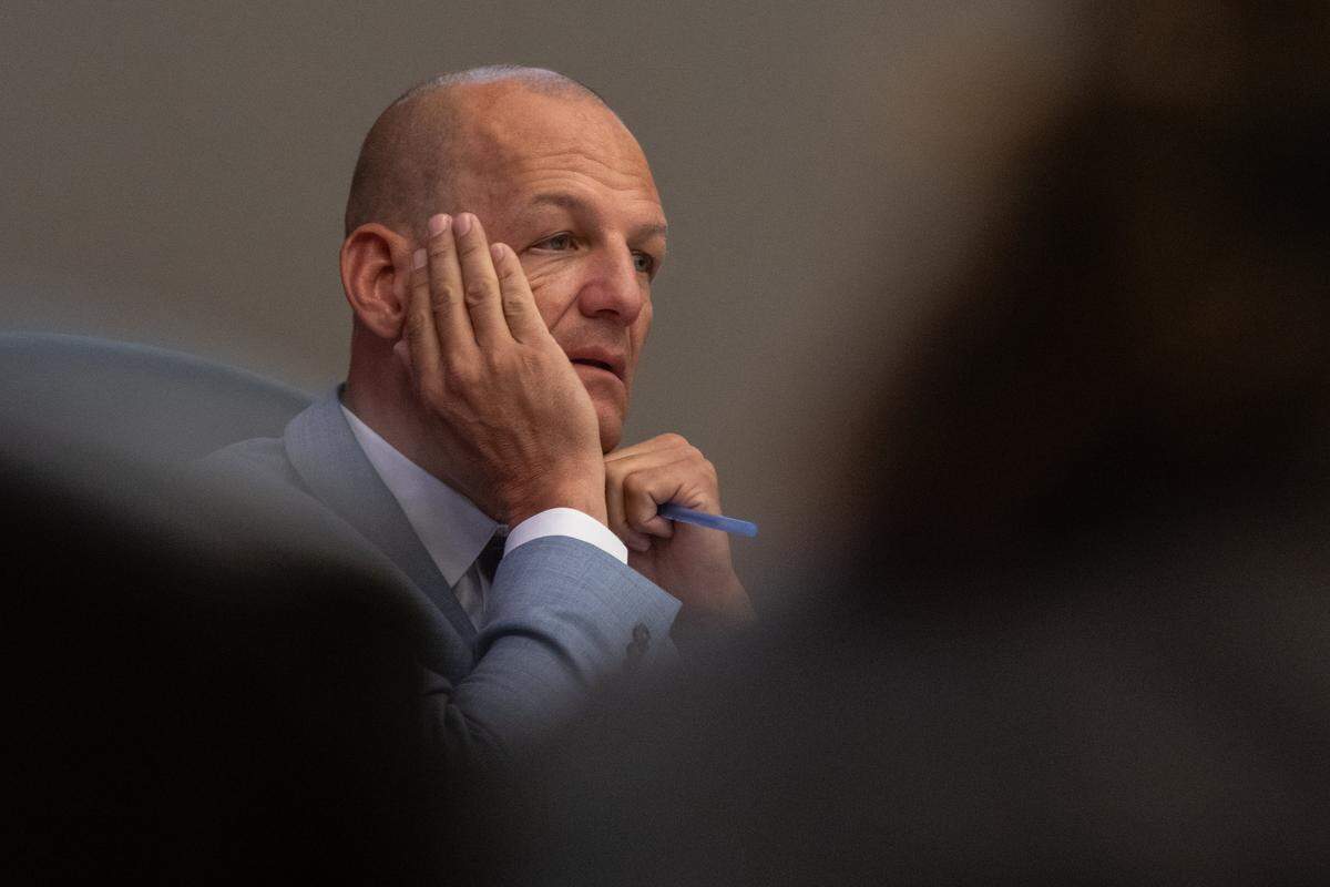 Sacramento Mayor Kevin McCarty rubs his head on Tuesday as he listens to people speak against a Sacramento City Council ordinance to ban homeless individuals from sleeping overnight outside City Hall. The ban passed.