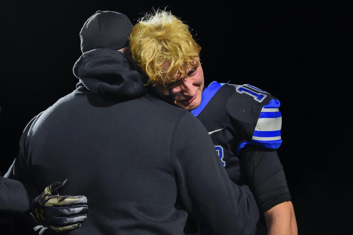 Rocklin Thunder wide receiver Gavin Correia (10) is consoled by his father Anthony Correia after losing the CIF Northern California Division 2-AA championship against the Grant Pacers on Friday.