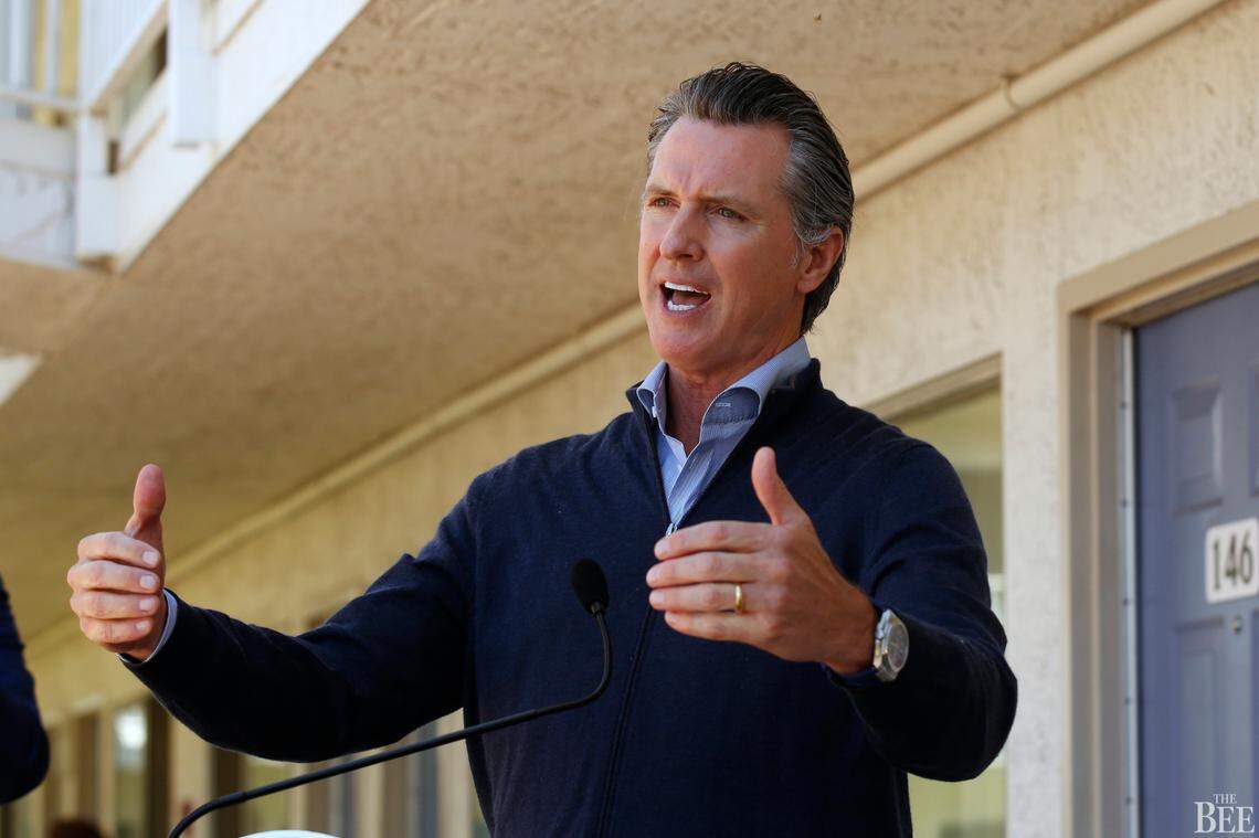 Gov. Gavin Newsom gives an update on the state’s initiative to provide housing for homeless Californians to help stem the coronavirus, during a visit to a Motel 6 participating in the program in Pittsburg, Calif., Tuesday, June 30, 2020. Newsom announced that more than 15,000 rooms have been acquired and more than 14,000 people have been given places to stay statewide under the Project Room key program started in April. The governor also said he plans to announce on Wednesday plans to “toggle back” the states stay-at-home order.