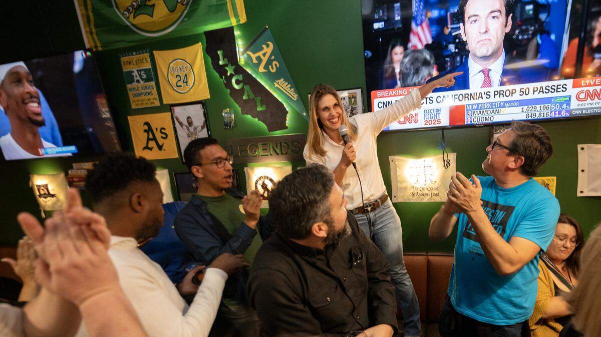 California Assemblymember Maggy Krell, D-Sacramento, points to the Proposition 50 results while hosting an election night party at Mojo’s Local Tap & Kitchen in Sacramento on election night. 