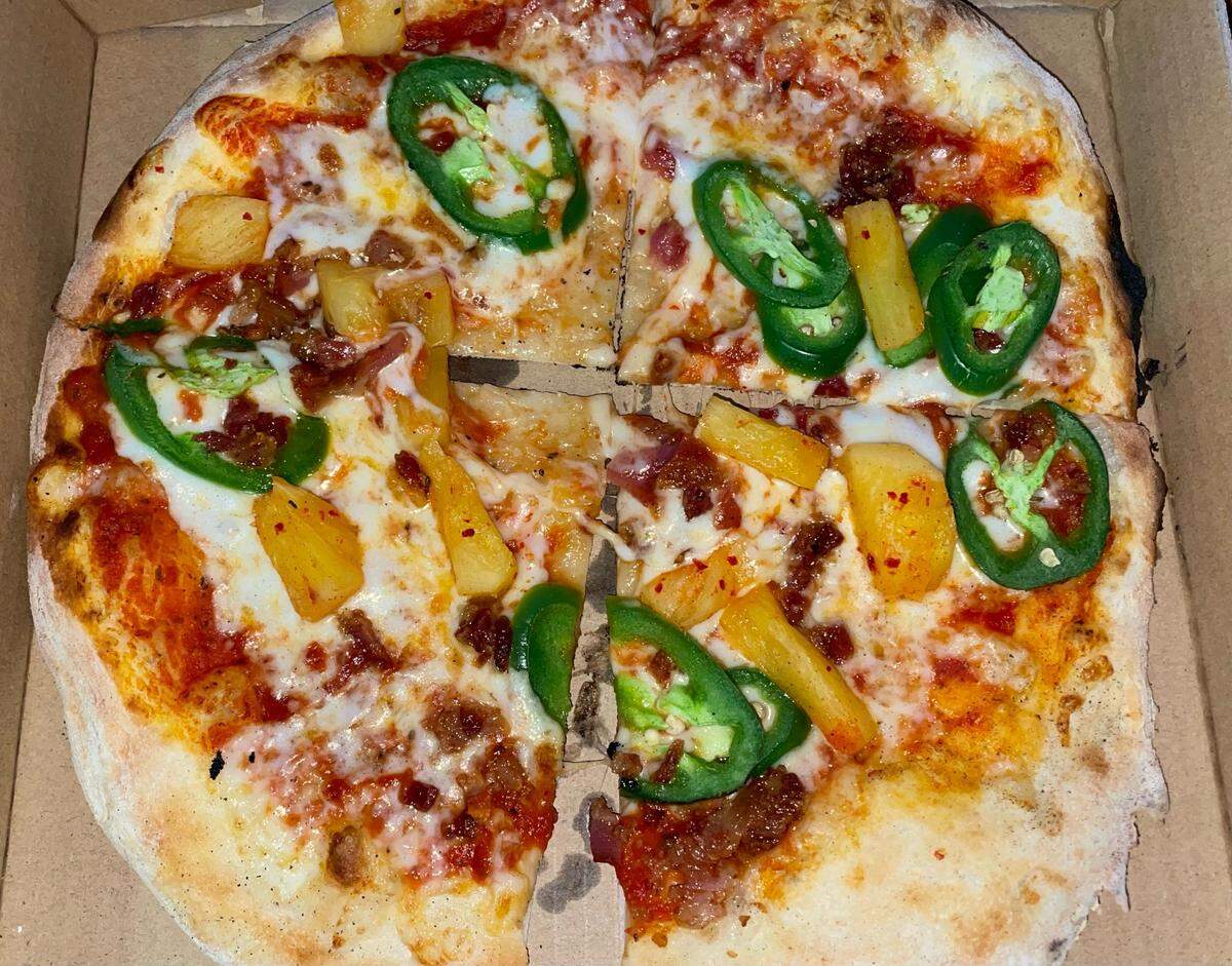 Drake’s: The Barn’s “EB” nine-inch personal pizza topped with red sauce, mozzarella cheese, jalapeno, pineapple and bacon.