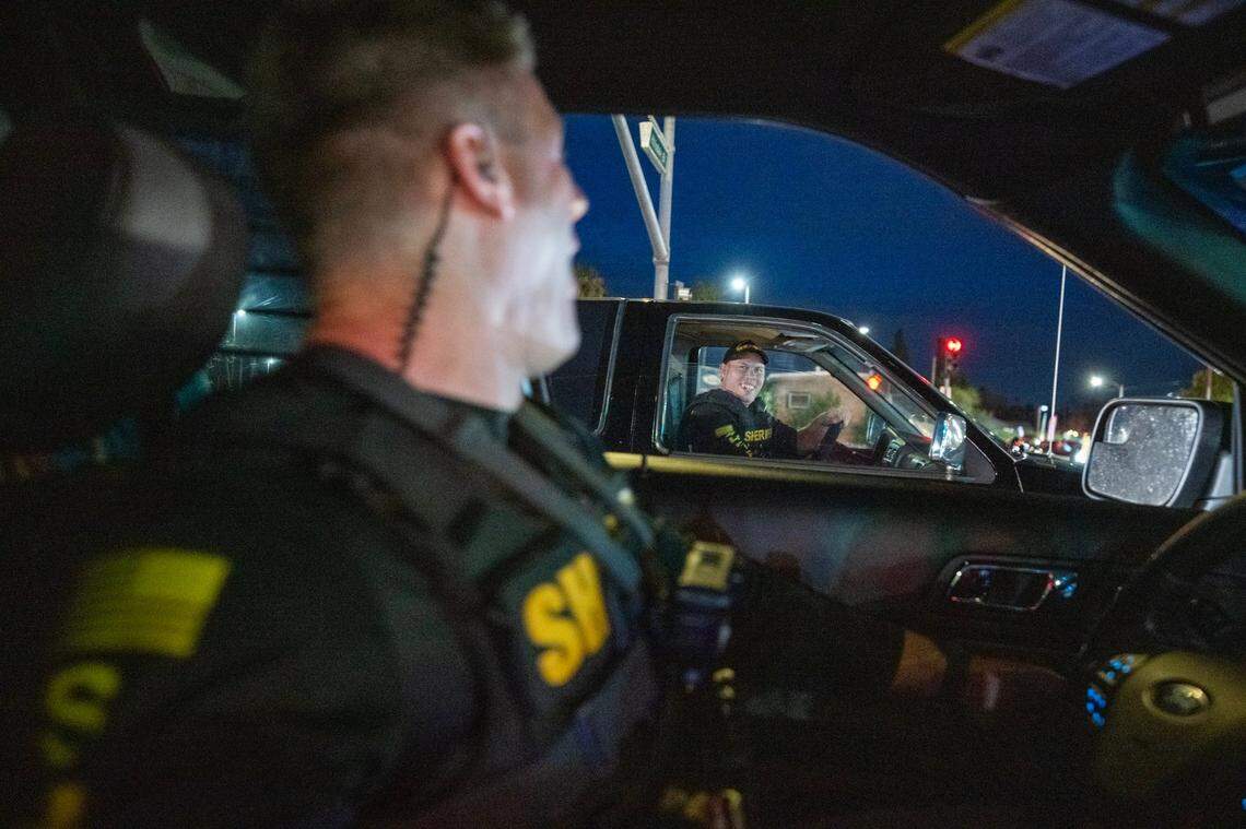 Sacramento Sheriff’s deputy Hampton, center, drives an impounded vehicle owned by a man arrested for propositioning a female deputy posing as a prostitute on Watt Avenue in North Highlands on Friday.