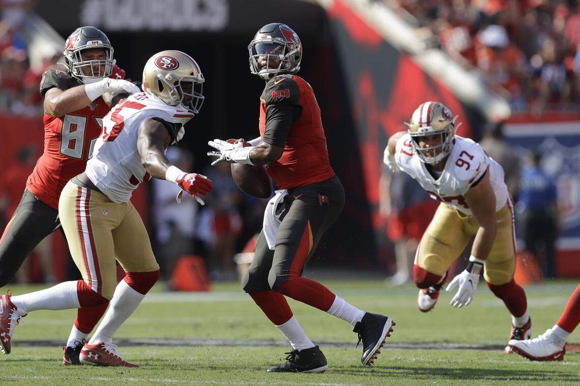 San Francisco defensive end Dee Ford strips the ball from Tampa Bay quarterback Jameis Winston.