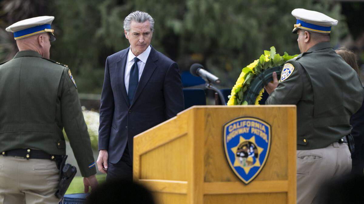 Gov. Gavin Newsom prepares to place a wreath for fallen officers during the CHP Memorial Ceremony in West Sacramento on Tuesday, May 5, 2026. The governor will lay out his final budget proposal today.