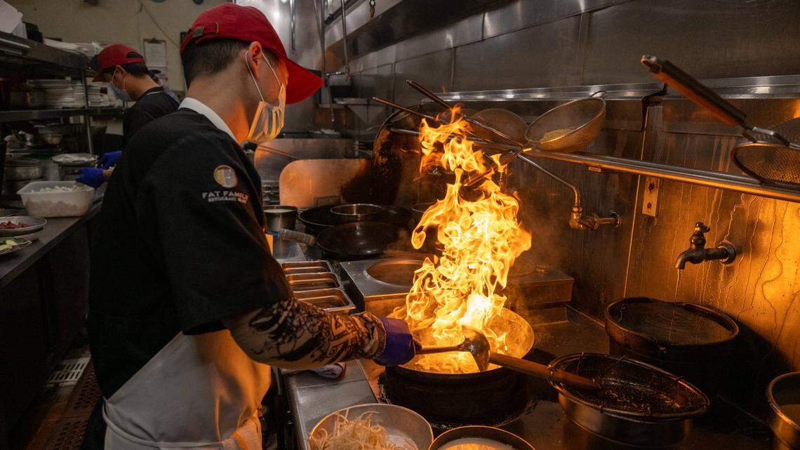 Chef Quan Sun cooks over gas stove using a wok to make Chinese cuisine at Frank Fats in Sacramento in May.