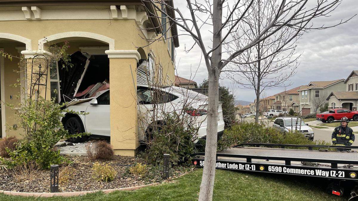 A Tesla crashed into a home in the Blackstone neighborhood of El Dorado Hills, California, on Sunday, Jan. 29, 2023. One person was treated and taken to a hospital, fire officials said. 
