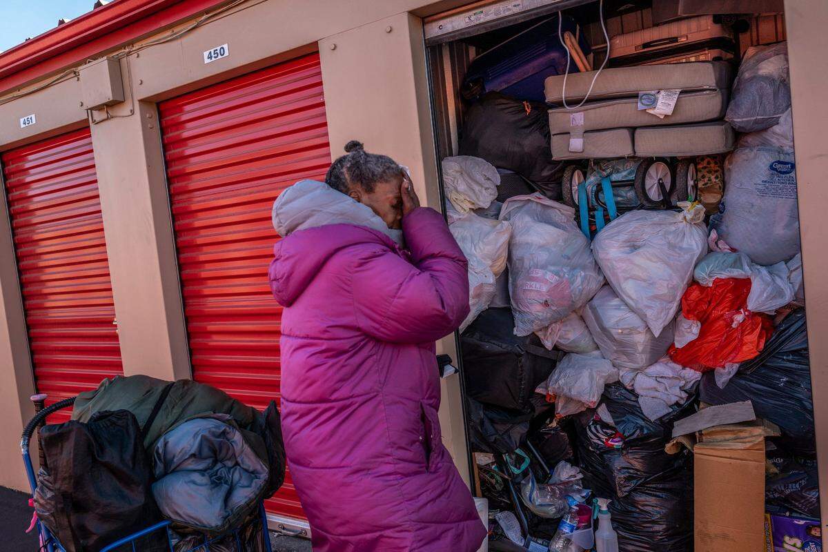 Sharon Pendarvis, 58, shows signs of stress as she wipes her face with a paper towel after searching for several hours for clothing, legal paperwork and supplies inside her storage unit in November. “It had impacted me a lot emotionally to the point where my post traumatic stress syndrome kicked in,” said Pendarvis about living in Sacramento Self-Help Housing.