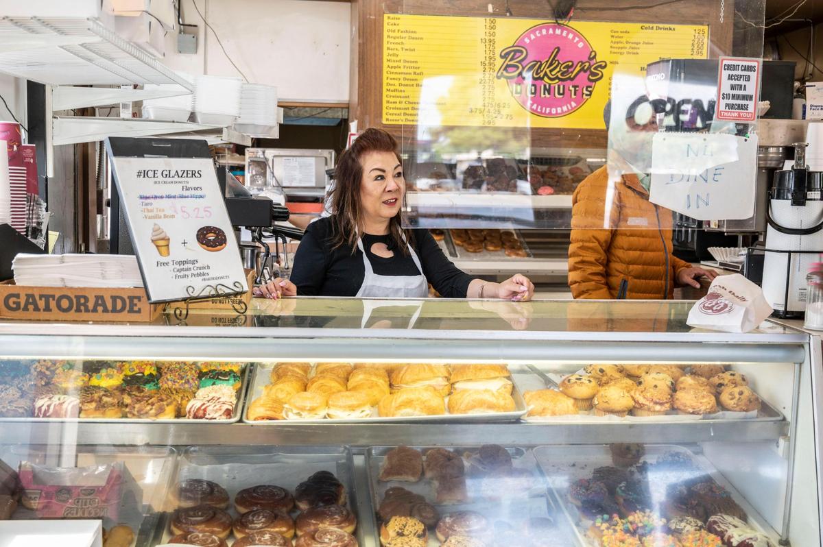 Suzie Hem owner of Baker’s Donuts on Florin Rd. in Sacramento on Monday, April 11, 2022 said that she’s not worried about the competition a new doughnut store will bring. “They have a lousy doughnut and they’re no gonna be able to compete with me,” she said about the new Dunkin’ Donuts opening this summer as loyal customers walked into her store and drove up to her drive thru window.