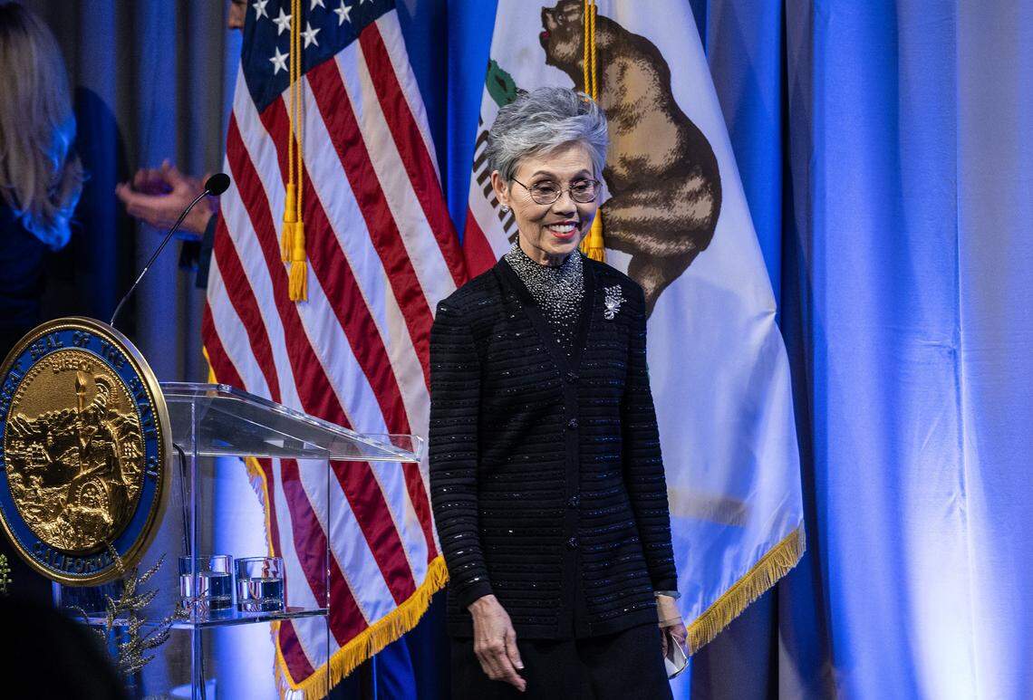 Helene An, chef and ”mother of fusion cuisine,” walks on stage before she received her medal from Gov. Gavin Newsom during the California Hall of Fame induction ceremony Tuesday, Feb. 6, 2024, in Sacramento.