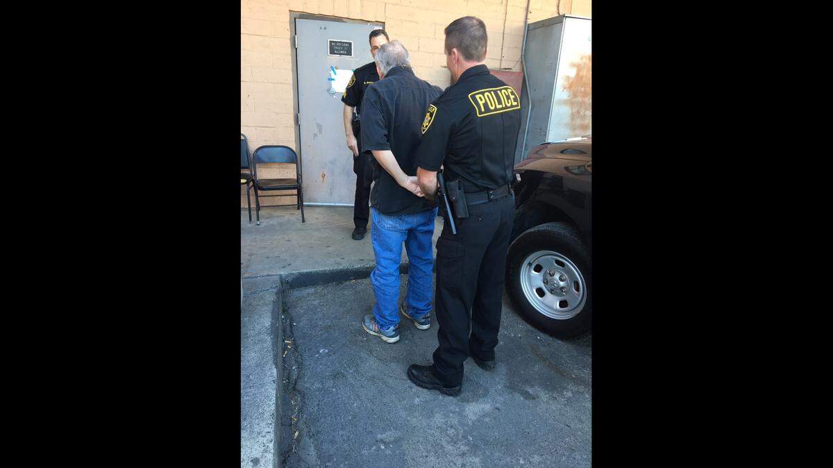 In this undated photo, agents from the California Department of Alcoholic Beverage Control arrest Kelly Woodward of Sacramento on charges of selling alcohol to a minor resulting in great bodily harm.