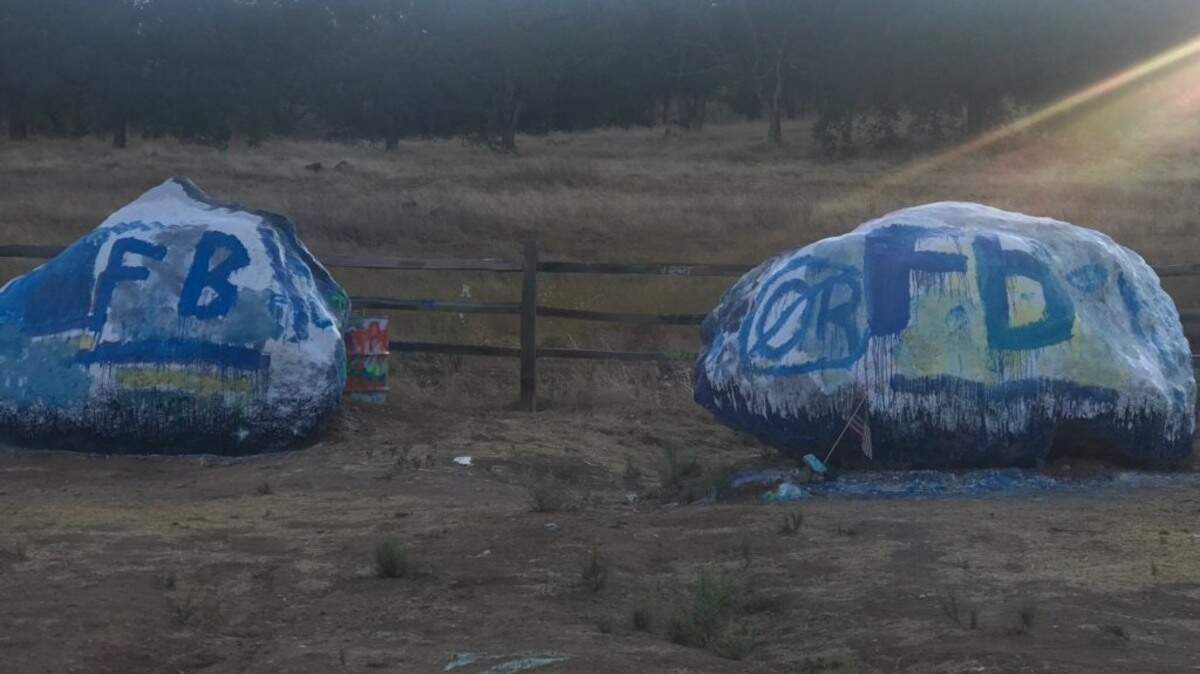 These El Dorado Hills rocks were painted over with Folsom colors overnight Friday.