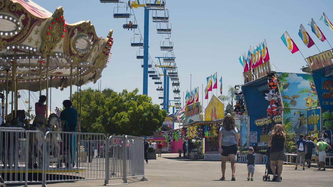 The new Sky Ride passes over the midway at the California State Fair in Sacramento in 2016. Cal Expo, where the fair is held, plans to lay off half of its staff after the coronavirus pandemic forced the fair’s cancellation.