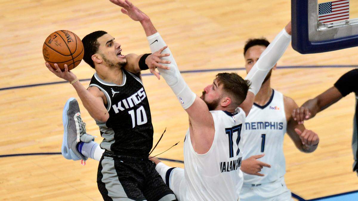 Sacramento Kings guard Justin James (10) shoots against Memphis Grizzlies center Jonas Valanciunas (17) in the second half of an NBA basketball game Thursday, May 13, 2021, in Memphis, Tenn. (AP Photo/Brandon Dill)