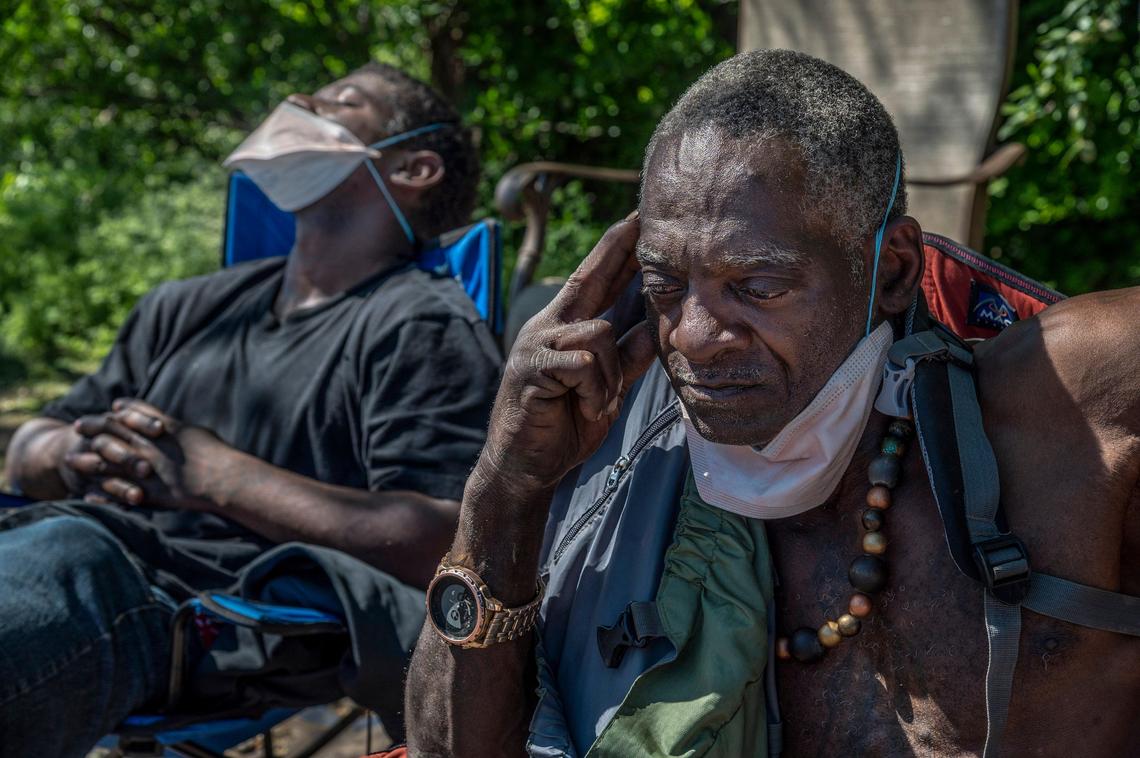 R. Brannon, right, said he was thankful for the medical students who helped answer life threatening questions after they passed out masks and helped inform him on the coronavirus pandemic at a homeless encampment in Sacramento on Monday, April 13, 2020. UC Davis and Cal Northstate medical students have been providing medical care to homeless people during coronavirus for the past three weeks on top of their full time class load.