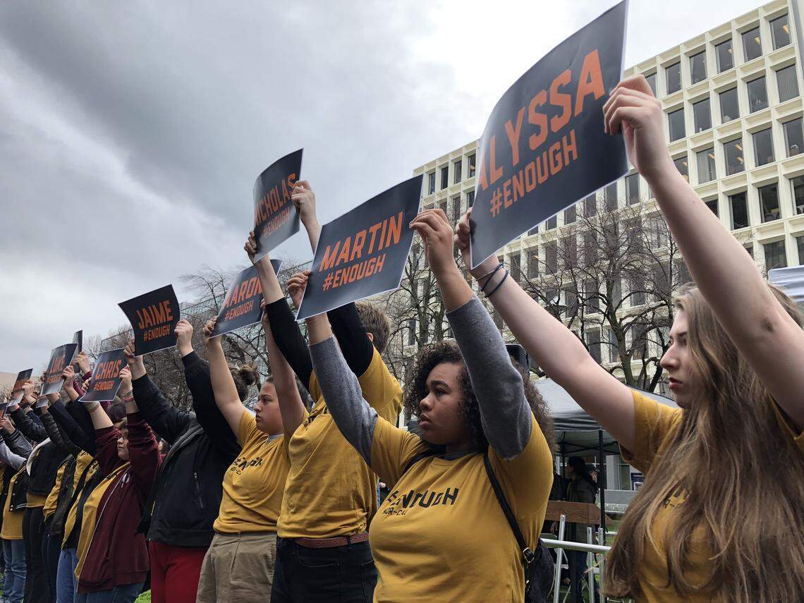 Protesters gather outside the NRA offices at 555 Capitol Mall in what's expected to be the city's largest protest on the National Student Walkout day.