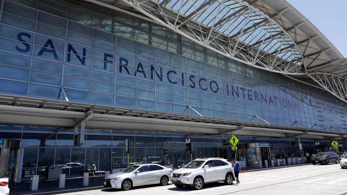 Vehicles wait outside the international terminal at San Francisco International Airport in San Francisco in 2017. A letter from San Francisco International Airport officials warns cabbies to use the bathrooms after reports of unsanitary goings-on in the taxi lot. Cab drivers deny the accusations.