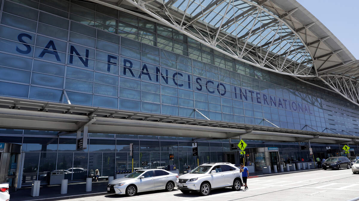 Vehicles wait outside the international terminal at San Francisco International Airport in San Francisco in 2017. A letter from San Francisco International Airport officials warns cabbies to use the bathrooms after reports of unsanitary goings-on in the taxi lot. Cab drivers deny the accusations.