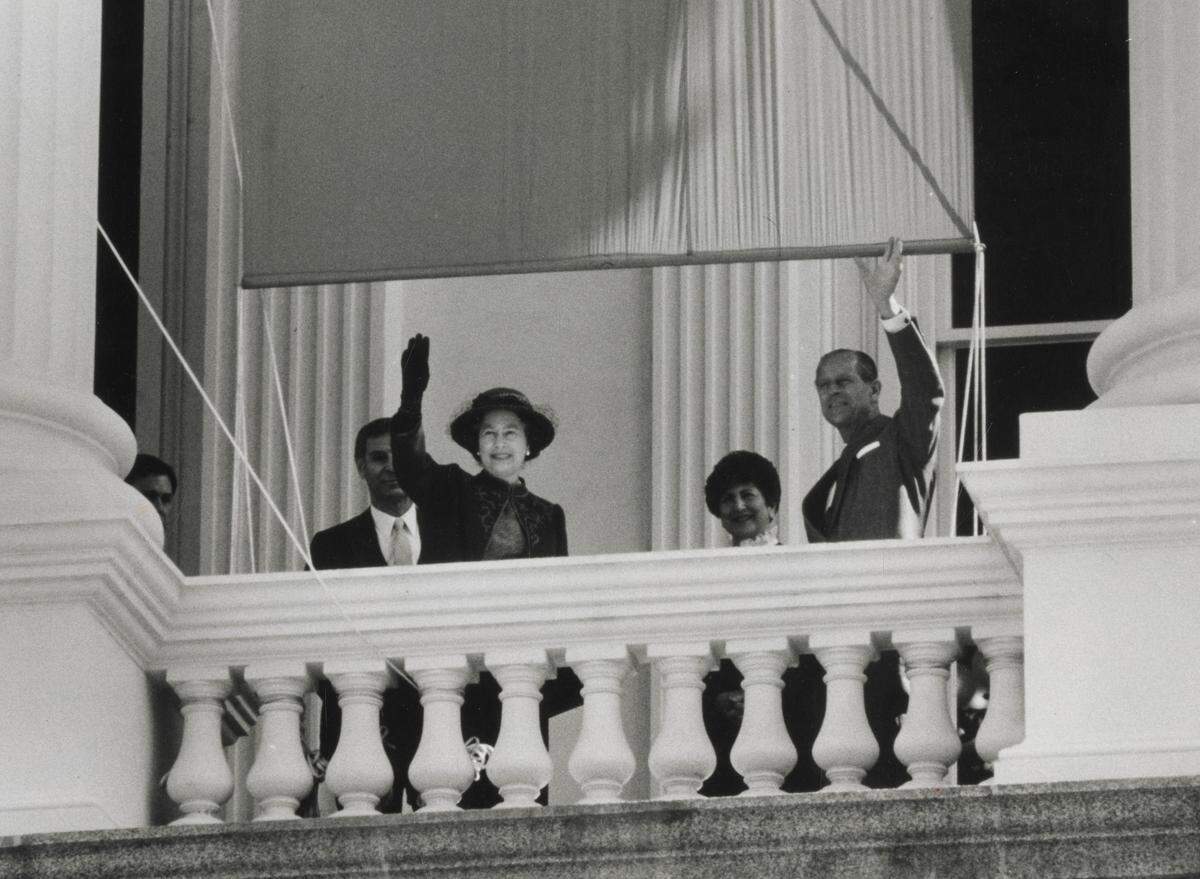 Queen Elizabeth II and Prince Philip wave to the crowd from the state Capitol in Sacramento during their visit in March 1983.