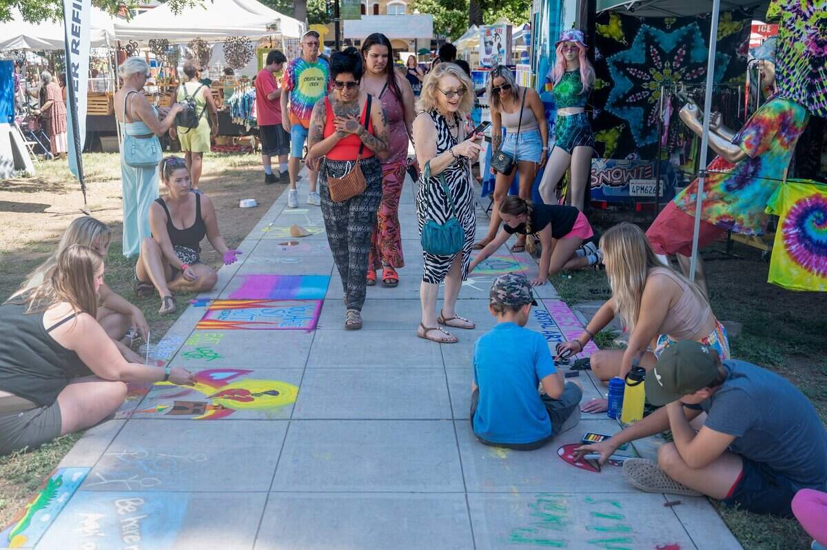 People admire the art being created by families at the Chalk It Up Festival on Sunday, Sept. 4, 2022, at Fremont Park in Sacramento.