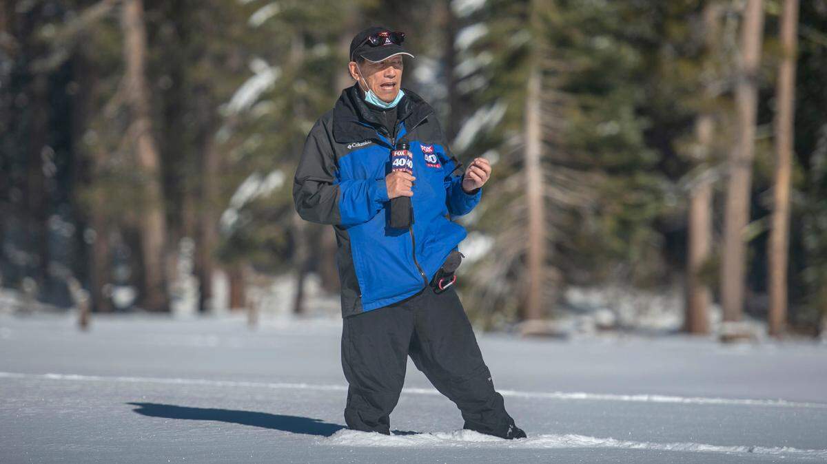 Lonnie Wong prepares to send his report on the snow survey at Phillips Station in the Sierra Nevada on Dec. 30, 2020. Long announced his retirement Sept. 1, 2021, after a 40-year career with Fox KTXL in Sacramento.